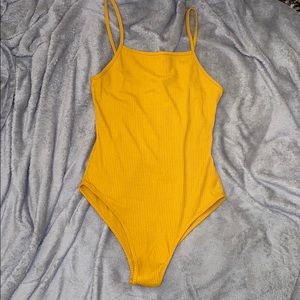 Bright yellow bodysuit